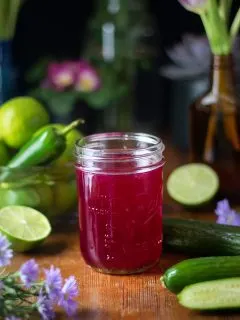 jar of deep pink dragon fruit simple syrup.