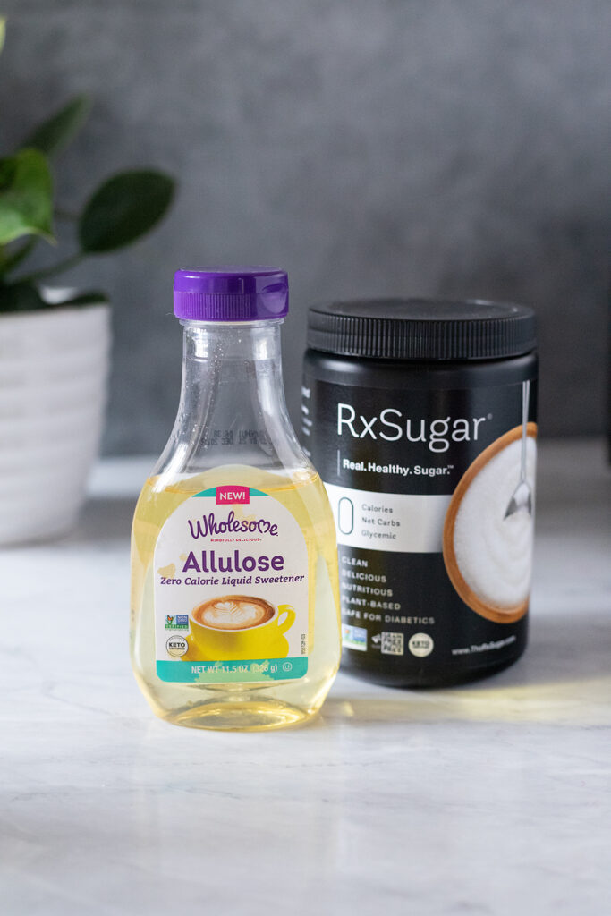 a bottle of allulose syrup and a canister of allulose powder.